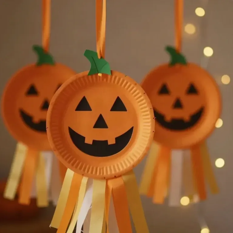 Kids crafting floating paper plate ghosts for Halloween decoration