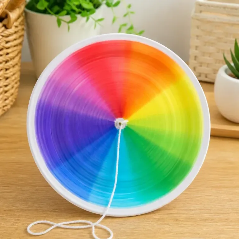 Colorful spinning rainbow craft promoting calmness and creativity.