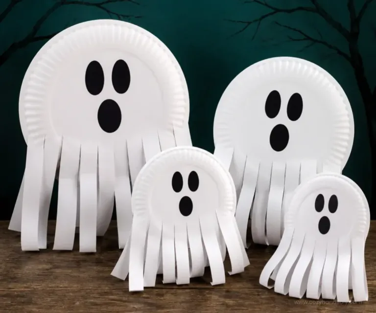 Home 9 Preschooler making Halloween ghost crafts with paper plates.